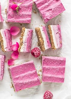 raspberry cheesecake bars with fresh raspberries on the side