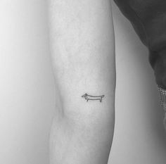 a person with a small tattoo on their arm