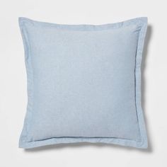 a light blue pillow on a white background