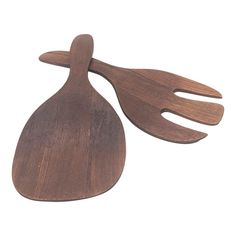 two wooden spatulas on a white background, one is shaped like an egg