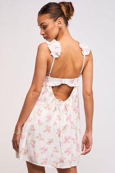 See the Lulu White and Pink Floral Ruffle Mini Dress at BohoPink.com! white & pink floral bustier dress with babydoll bodice. Express shipping is available! Flowy Mini Dress Lulus, Cheap Flowy Mini Dress With Ruffles, Spring Flower Dress Pink, Pink Ruffle Floral Mini Dress, White And Green Floral Mini Dress, Cheap Bohemian Mini Dress With Ruffles, Cowuette Floral Mini Dress, Cheap Pink Bohemian Mini Dress, Spring White Floral Dress