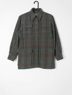 Womens vintage Saint Laurent plaid flannel shirt. Pure wool, made in France circa 1970. Our recommended size: XS to Small (Please check specific measurements below) Label Says: no size shown Condition: very good; has had one small hole repair on the bottom pocket on the front which is barely noticeable amidst the overall pattern. Please see photos. Material: 100% wool Measurements in inches: Pit to pit: 18.5 Shoulders: 14 Front length: 27 Back length: 27 Sleeve length: 215 We've provided garment Plaid Shirt With Welt Pockets For Fall, Fall Plaid Shirt With Welt Pockets, Plaid Wool Shirt For Fall, Fall Plaid Wool Shirt, Plaid Wool Long Sleeve Shirt, Fall Plaid Shirt With Patch Pockets, Wool Shirt With Welt Pockets For Fall, Plaid Wool Top For Fall, Vintage Fall Shirt With Pockets