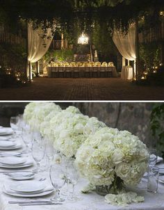 the table is set with white flowers and place settings for an outdoor dinner or reception