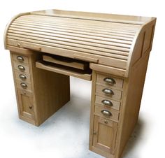 a wooden desk with several drawers on it