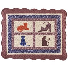 a quilted wall hanging with cats and kittens on the front, one cat is laying