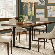 a dining room table and chairs in front of a window with cityscape on the wall