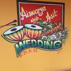 a sign painted on the side of a building that says, asburya wedding