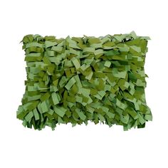 a pillow made out of green tissue paper on a white background with clippings in the shape of rectangles