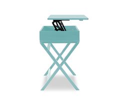 a small blue table with an umbrella on top