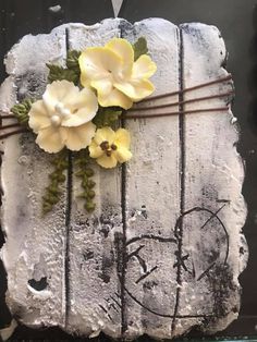 a cake decorated with flowers and writing on it