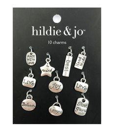 six charms that say i love you to the moon and back with words on them