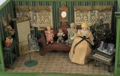 a doll house with furniture and dolls in it