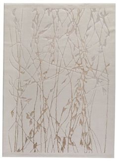 a white rug with some brown plants on it