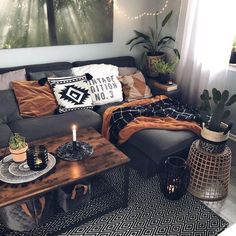 a living room filled with lots of furniture and decor on top of a wooden table