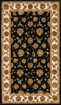 a black rug with gold and white flowers on it, in the middle of a room