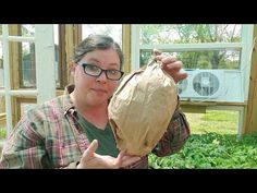 a woman holding up a bag in front of her face