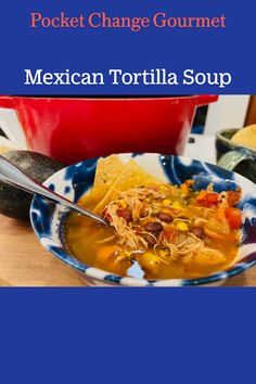 mexican tortilla soup in a blue and white bowl