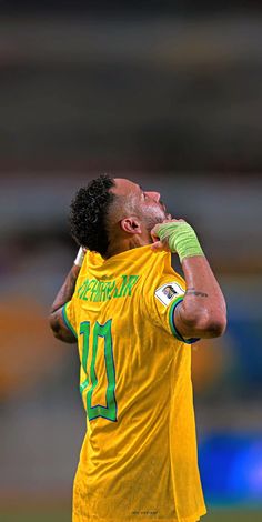 a soccer player with his head in his hands