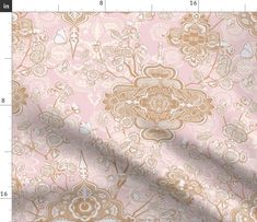 an image of a pink and gold wallpaper with floral designs on it's side