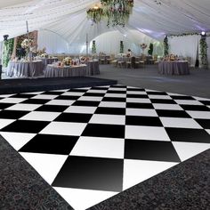 a black and white checkered dance floor with chandelier