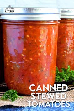 three jars filled with canned tomato sauce and garnished with parsley