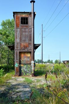 an old building with graffiti on the side