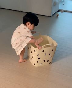 a small child playing with a toy in a room