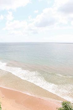 an ocean view from the top of a hill