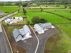 an aerial view of two houses in the countryside