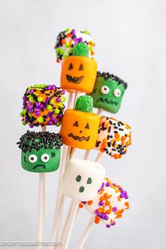 halloween marshmallows with jack - o'- lantern faces and sprinkles on them