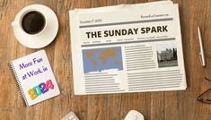 a newspaper with the sunay spark on it next to a cup of coffee