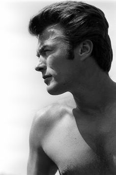 black and white photograph of a man with no shirt on