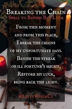 a table with candles and other items on it, including an image of the words breaking the chain spell to banish baby luck