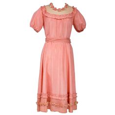 Circa 1920/1930 France Pretty summer dress in pink rayon decorated with roses dating from the years 1920/1930. Pleated bustier with small puffed sleeves and bateau neckline with cotton mesh neckline adorned with roses. Falbalas pleated in pink rayon on the neckline with a reminder at the bottom of the skirt with a mesh flounce and roses in buttons. Snap fastener on the left side and small belt in matching cotton mesh. No lining. Note two small snags in the bottom net (less than 1 cm) and one mis French Summer Dress, Pleated Bustier, Pretty Summer Dress, Pretty Summer Dresses, 1920s House, French Summer, Small Belt, Taffeta Fabric, True Summer