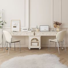 a desk with two chairs and a white rug