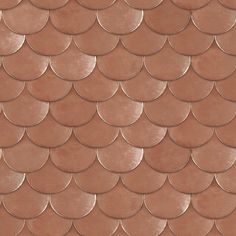 a close up view of the scales of a fish scale pattern on a brown background