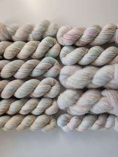 several skeins of yarn stacked on top of each other