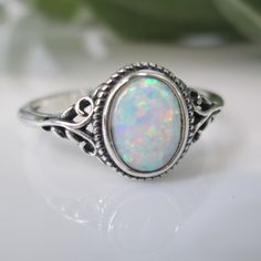 Dainty Opal Ring. Best Seller. For Your Consideration Is This Oh So Pretty 925 Sterling Silver And Opal Ring. Simple, Comfortable, And Beautifully Crafted. Face Height On This = 10mm. An Oval Fiery White Lab Opal Is The Star. A Little Oxidized Detailing Is A Great Accent To This Lovely Oval Opal Stone. Ref:Sid-F26 Opal And Silver Ring, Fine Jewelry Sterling Silver Oval Opal Ring, White Oval Adjustable Rings, Adjustable White Oval Rings, Oval Opal Stackable Rings, Adjustable Oval Opal Ring In White Gold, Silver Oval Opal Birthstone Ring, Silver Opal Birthstone Ring Oval Shape, Dainty Oval Sterling Silver Stackable Rings