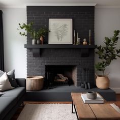 a living room with a couch, coffee table and fireplace