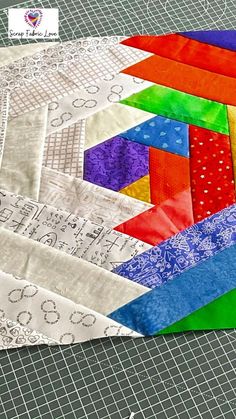 a close up of a colorful quilt on a table