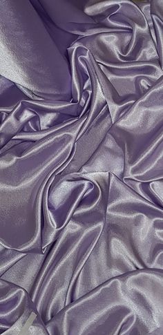 the fabric is very soft and shiny with some light purple colors on it's surface