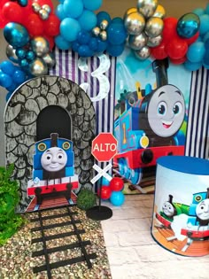 thomas the tank engine birthday party decoration with balloons and streamers, train table decor