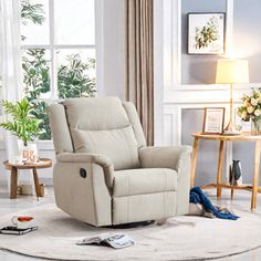 a living room with a white rug and a beige recliner