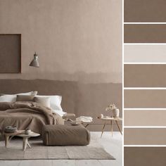 a bed sitting in a bedroom next to a wall with paint swatches on it