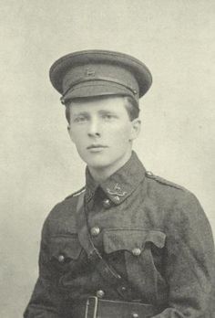 an old black and white photo of a young man in uniform, wearing a hat