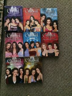 the dvd covers for charmed are laying on the floor