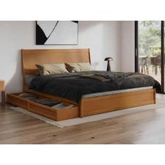 a bed sitting on top of a hard wood floor