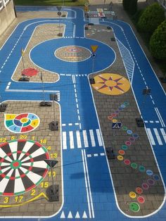 an aerial view of a painted parking lot with darts and darts on the ground