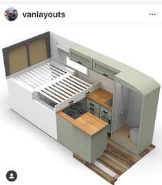 an image of a tiny kitchen with the bed pulled out and cupboards open on both sides