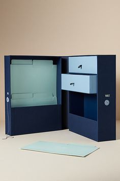 an open blue box with two drawers